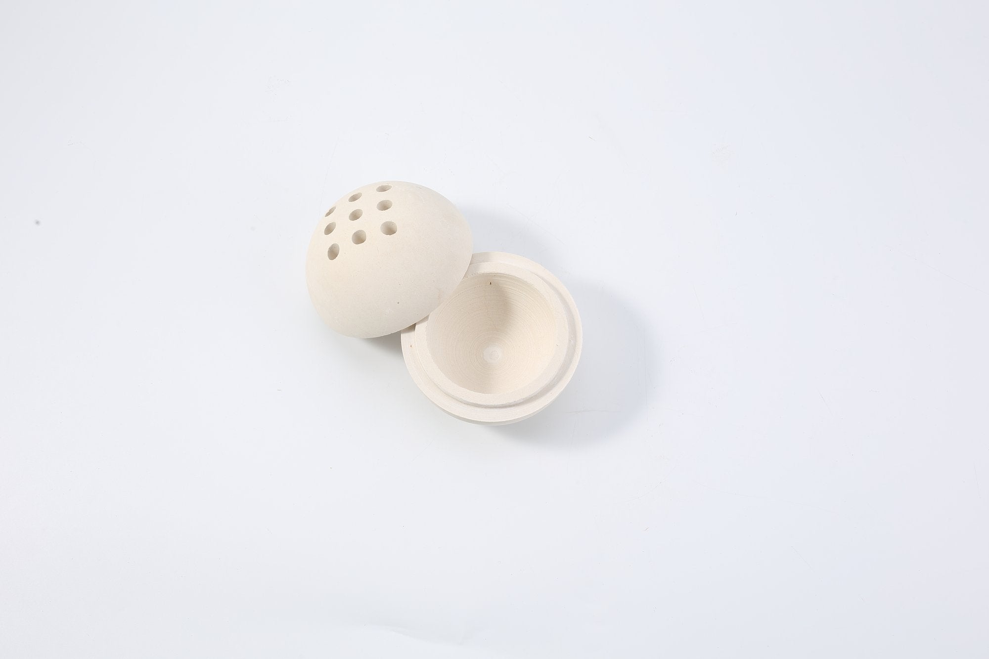 Koville natural marble incense burner d 100 in Moleanos Beige with burning incense stick