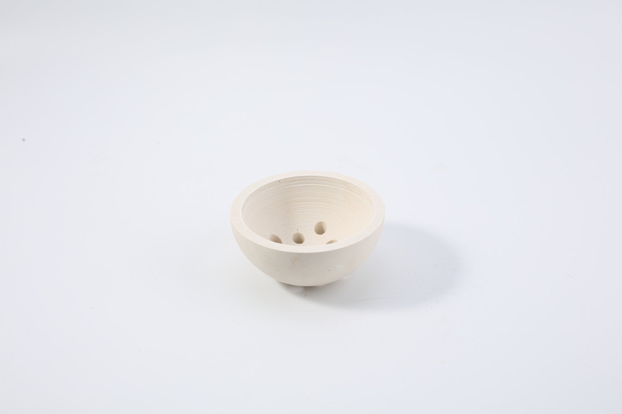Koville natural marble incense burner d 100 in Moleanos Beige with burning incense stick