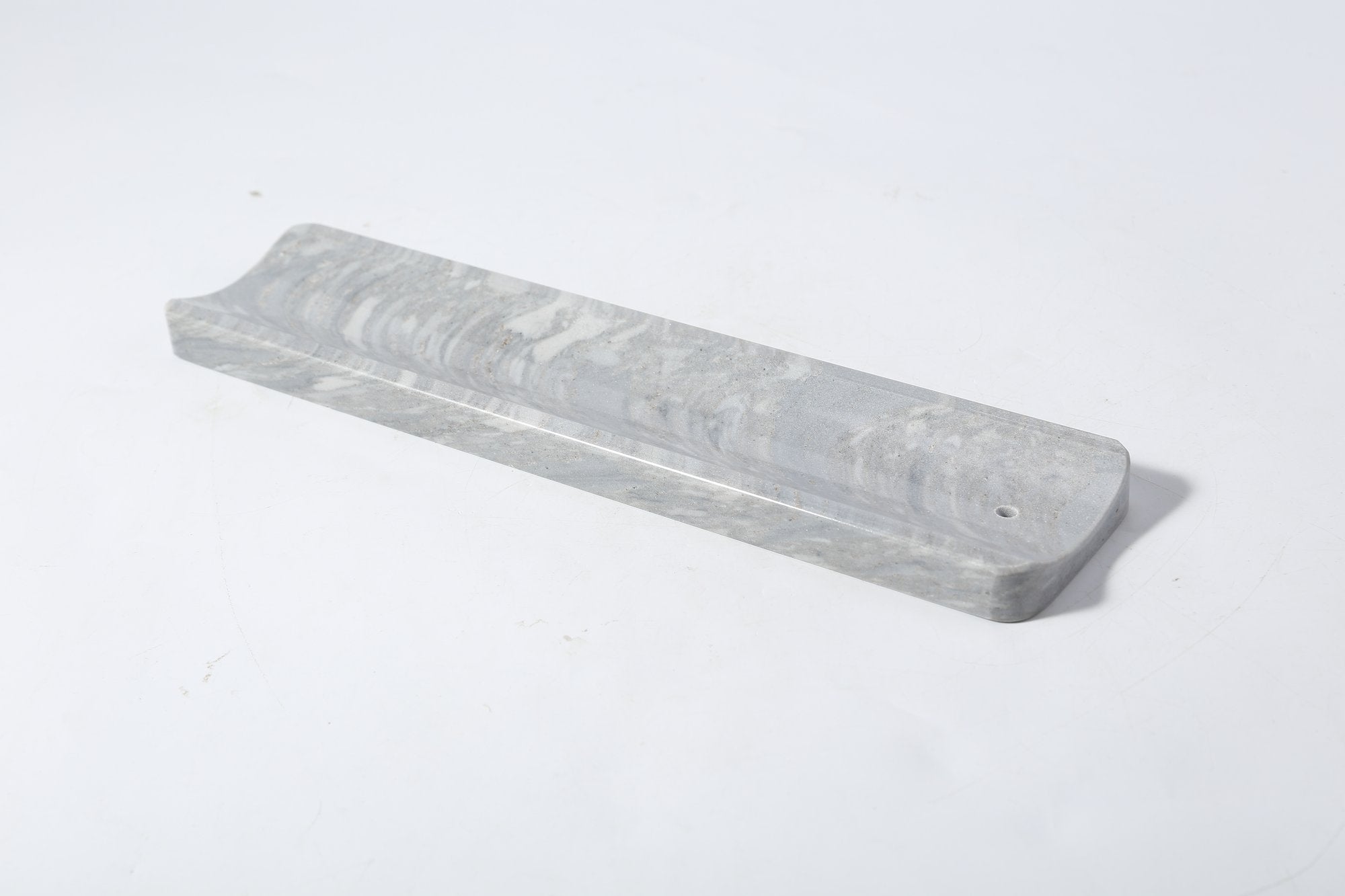 Koville natural marble incense holder slanted hole in Palissandro Blue with burning incense stick