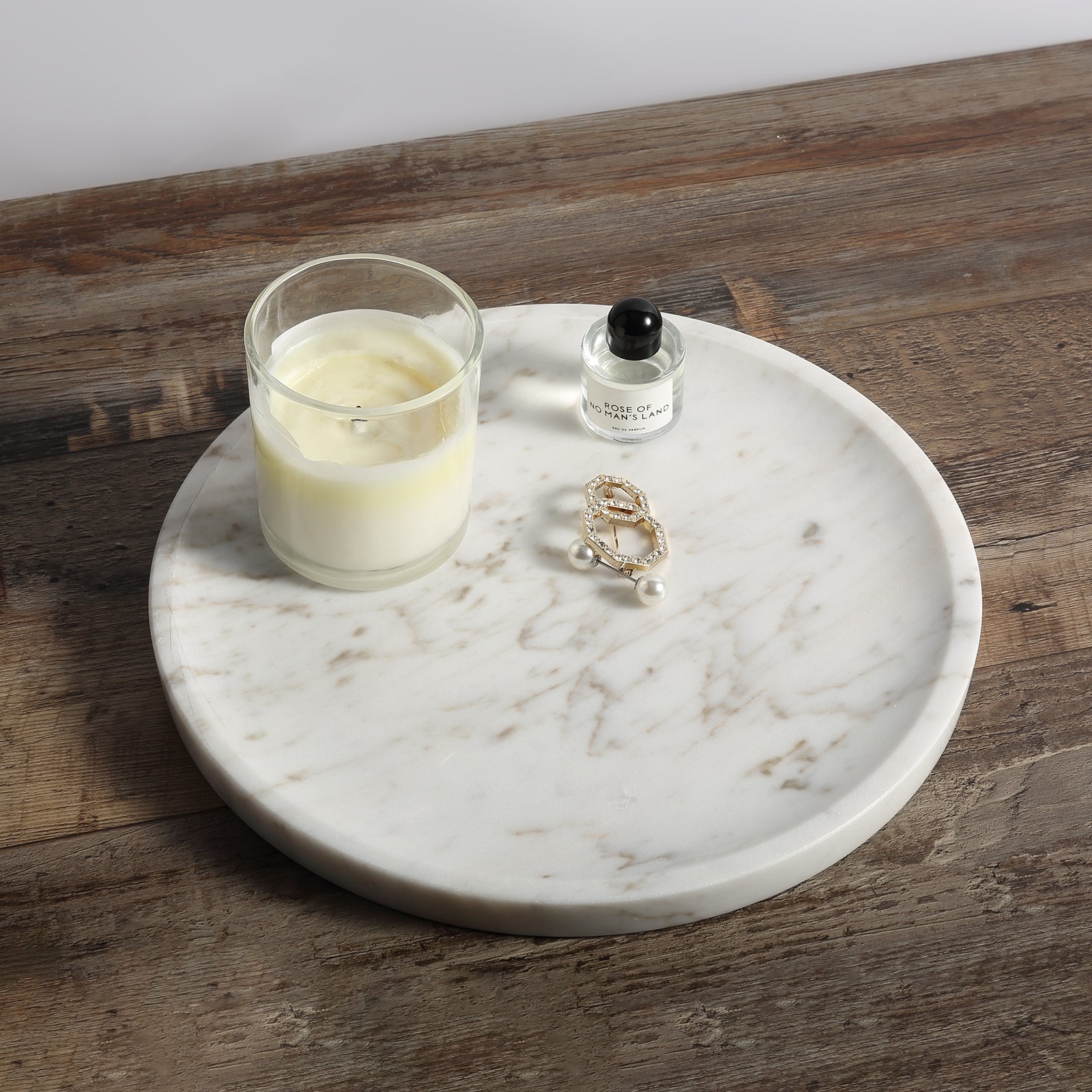 Koville round serving tray in multiple sizes for table styling in Volakas natural stone