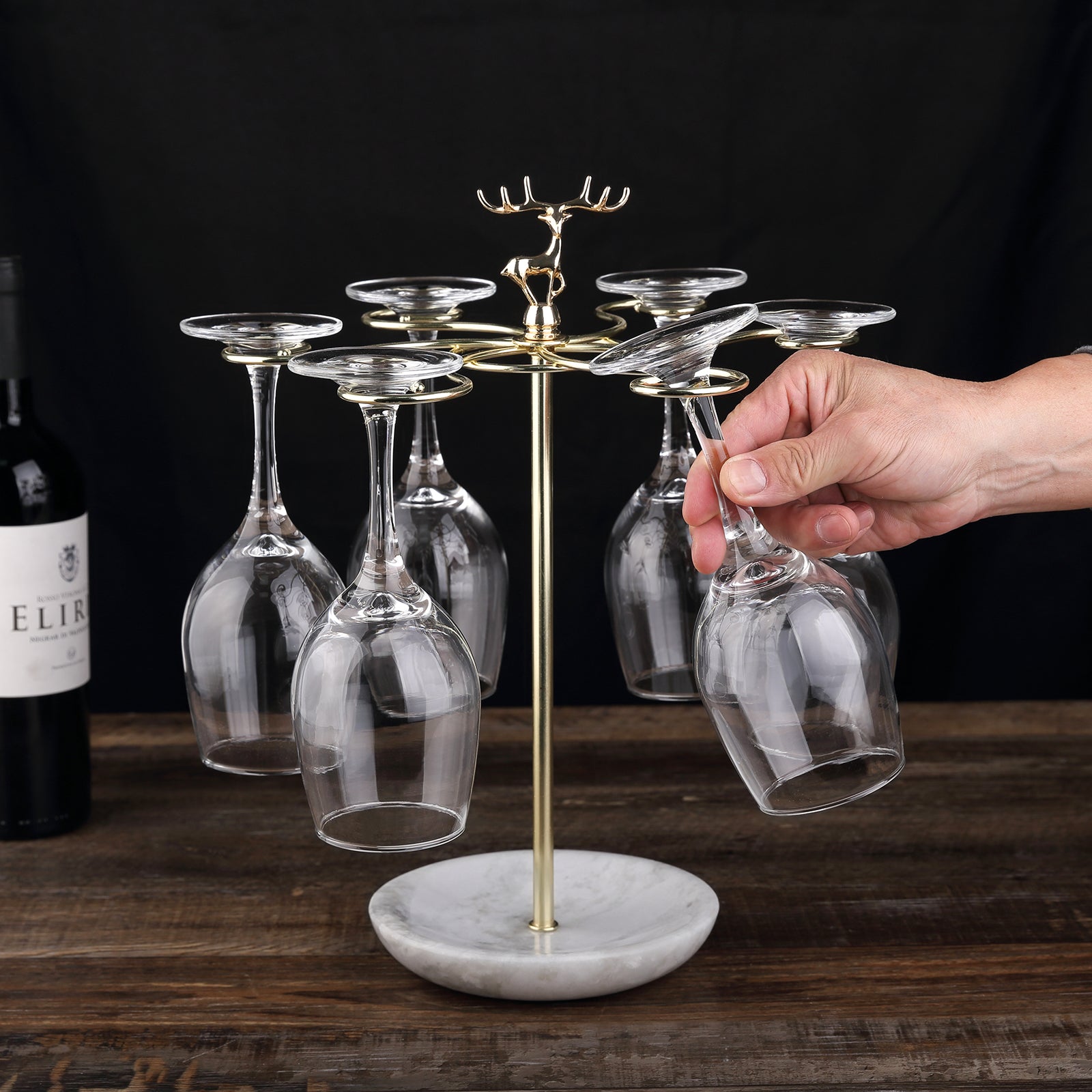 Koville Natural Stone Stemware Rack in Namib Fantasy mounted under a cabinet holding wine glasses