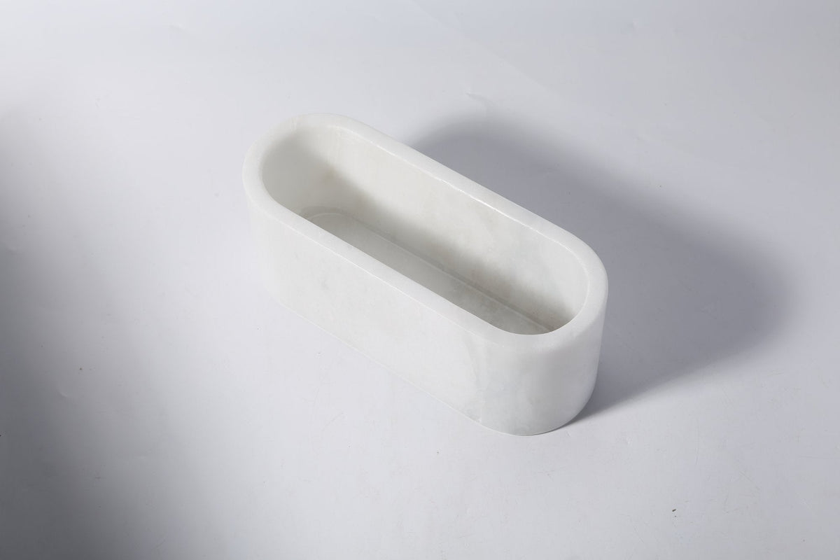 Koville candle holder in Namib Bianco with a lit tea light candle