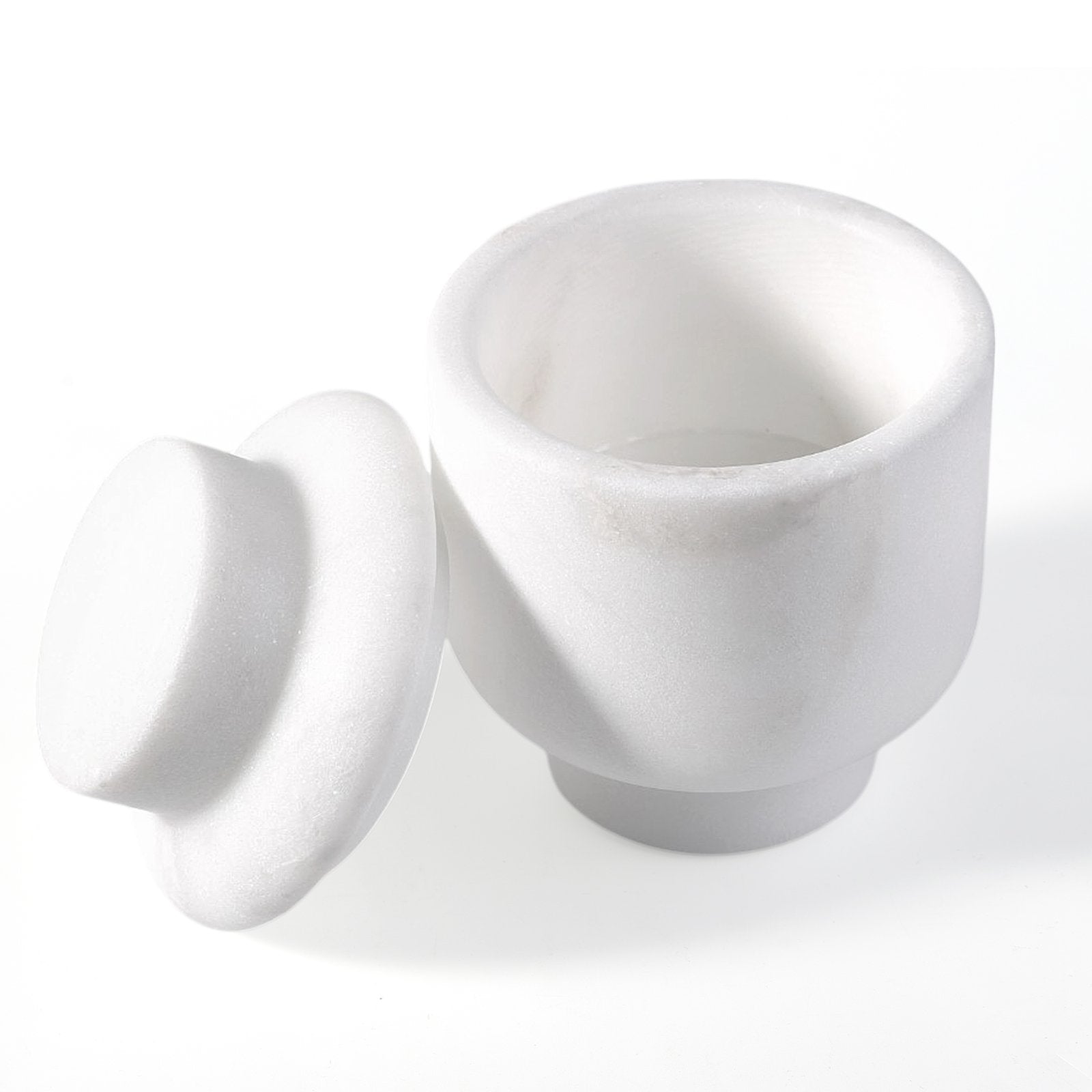 Koville natural marble candlelight cup d 100 t 140 in Namib Bianco with a lit tea light candle