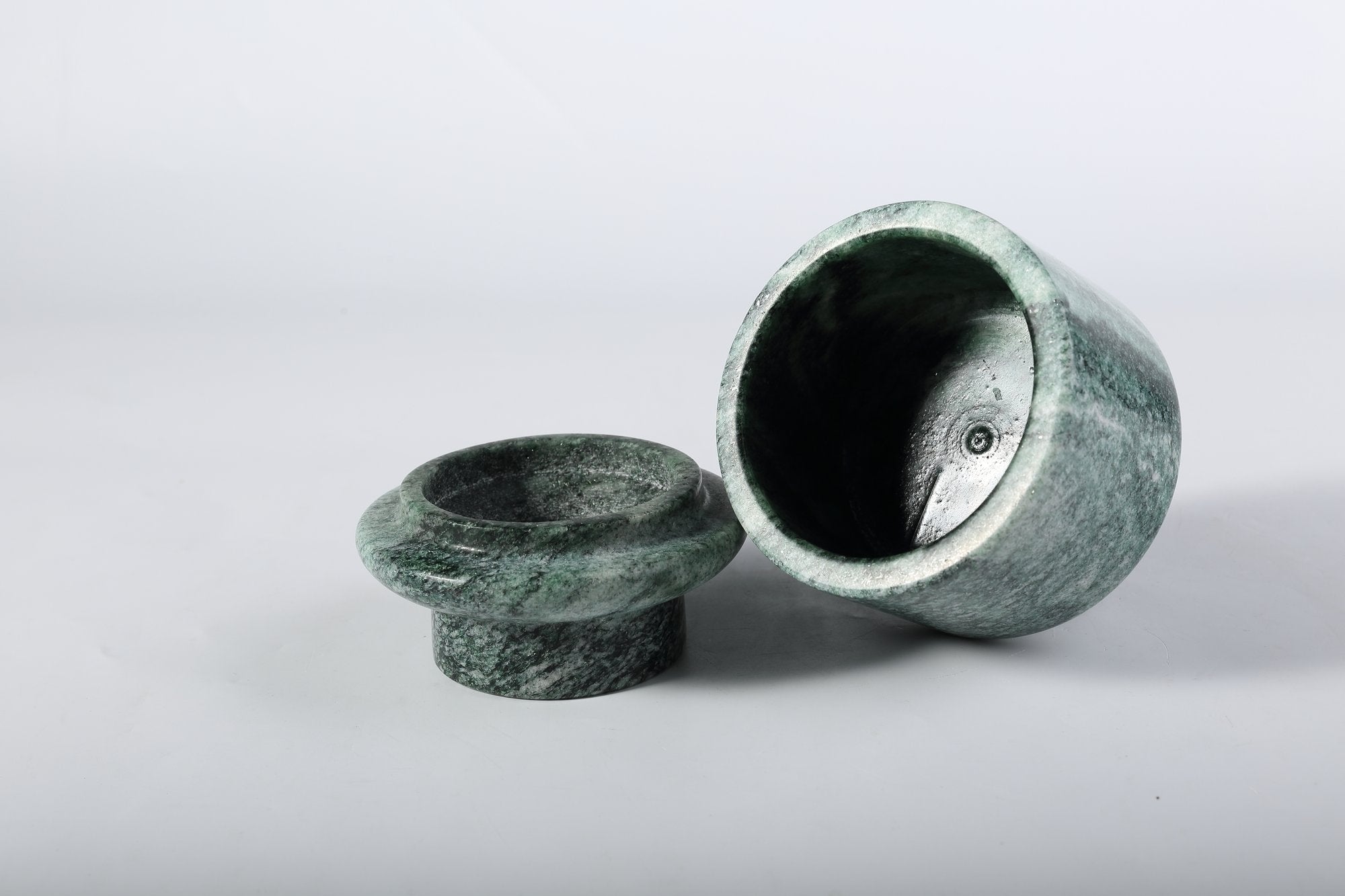 Koville natural marble candlelight cup d 100 t 140 in Verde Lapponia with a lit tea light candle