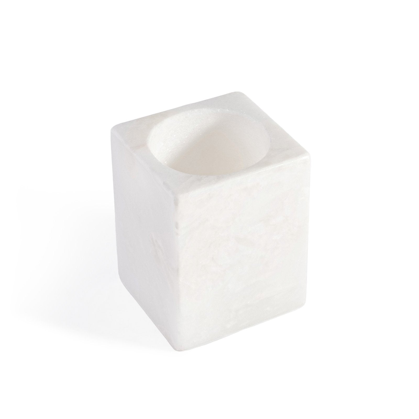 Koville natural marble candlelight cup d 70 in Namib Bianco with a lit tea light candle