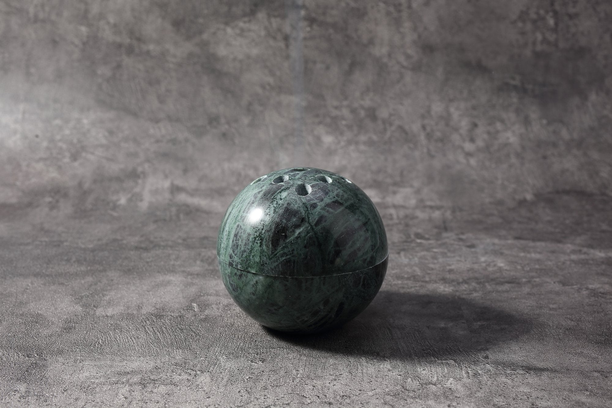 Koville natural marble incense burner d 100 in Indian Green with burning incense stick