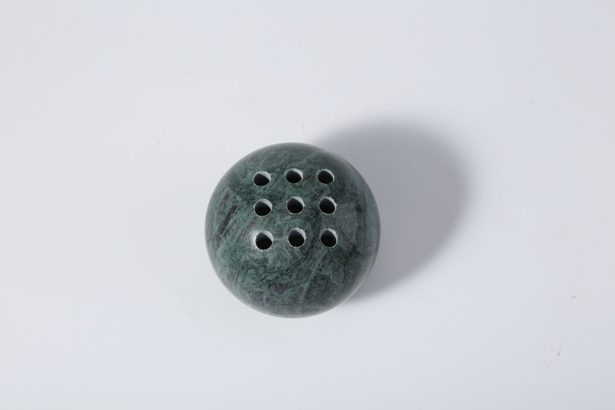 Koville natural marble incense burner d 100 in Indian Green with burning incense stick