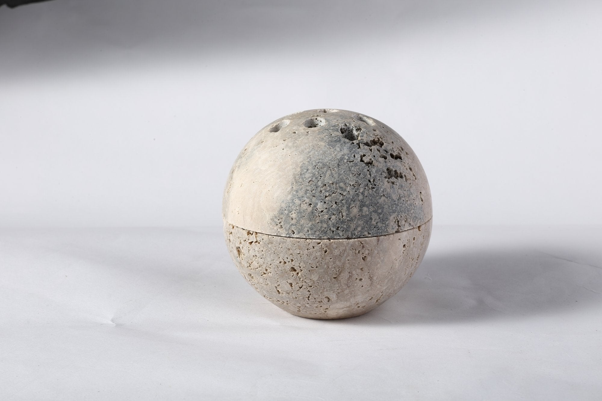 Koville natural marble incense burner d 100 in Travertine Silver with burning incense stick