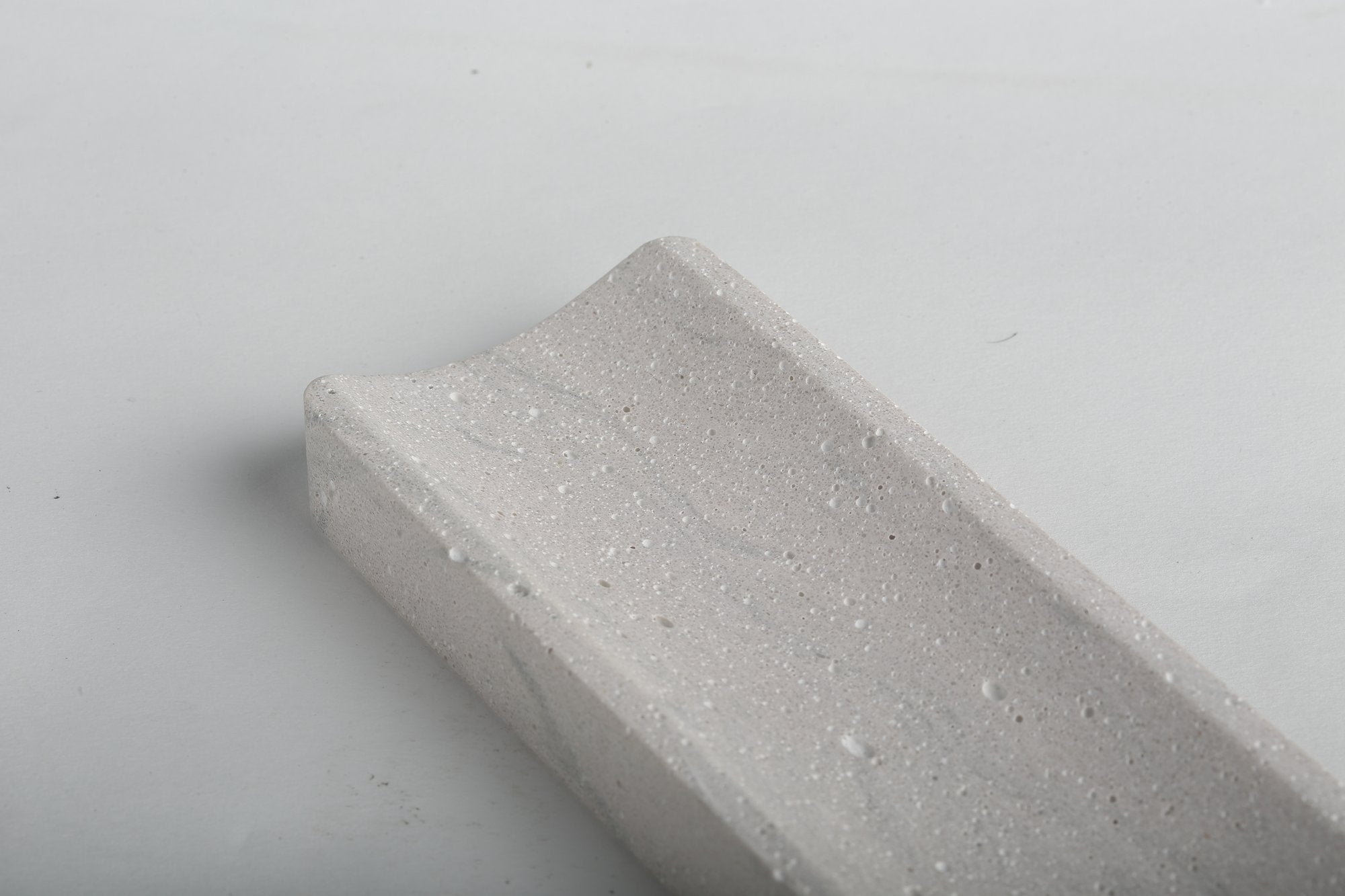 Koville natural marble incense holder in Rhino Grey with burning incense stick