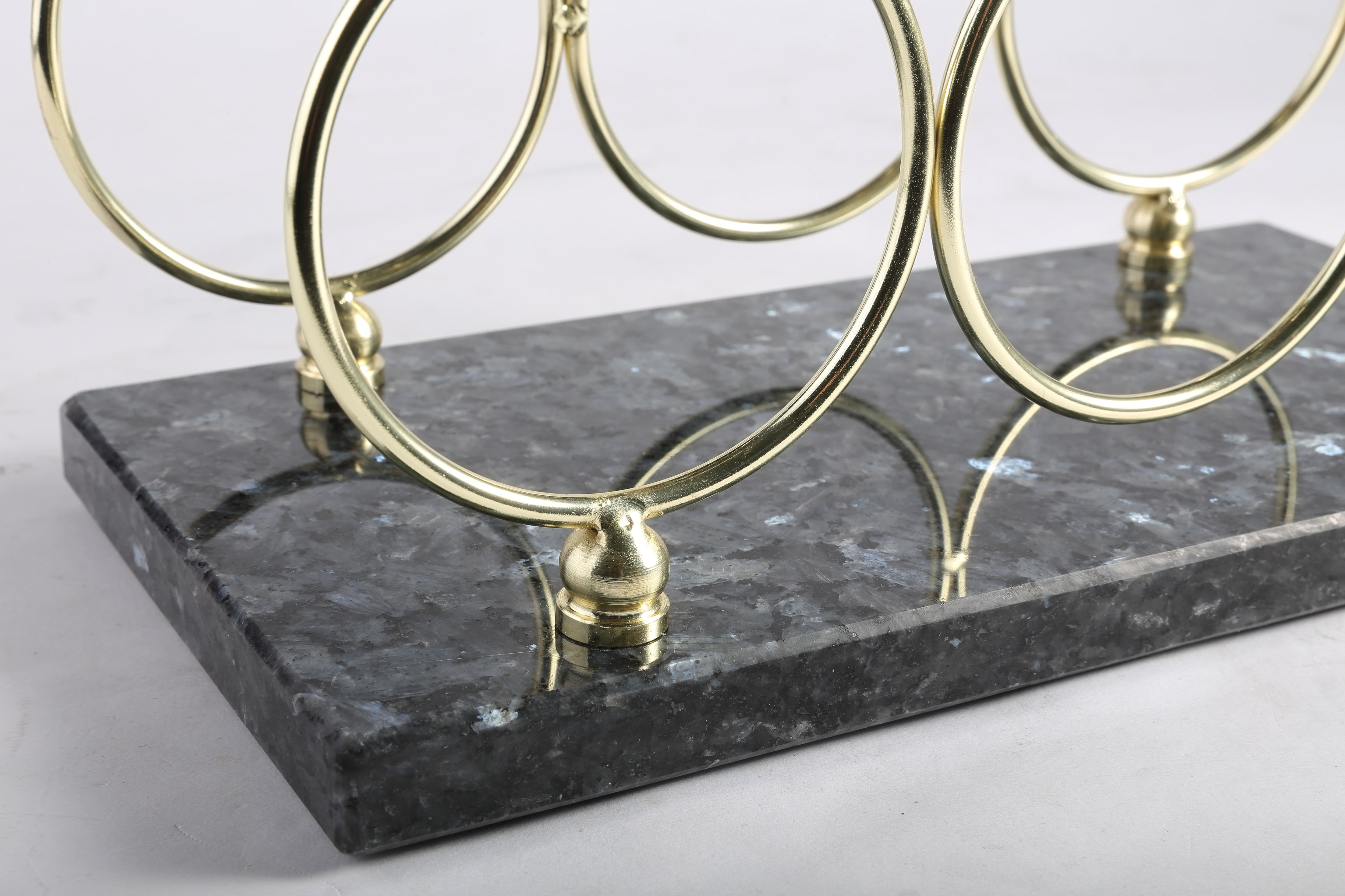 Koville Natural Stone Wine Rack in Blue Pearl on a kitchen counter holding wine bottles