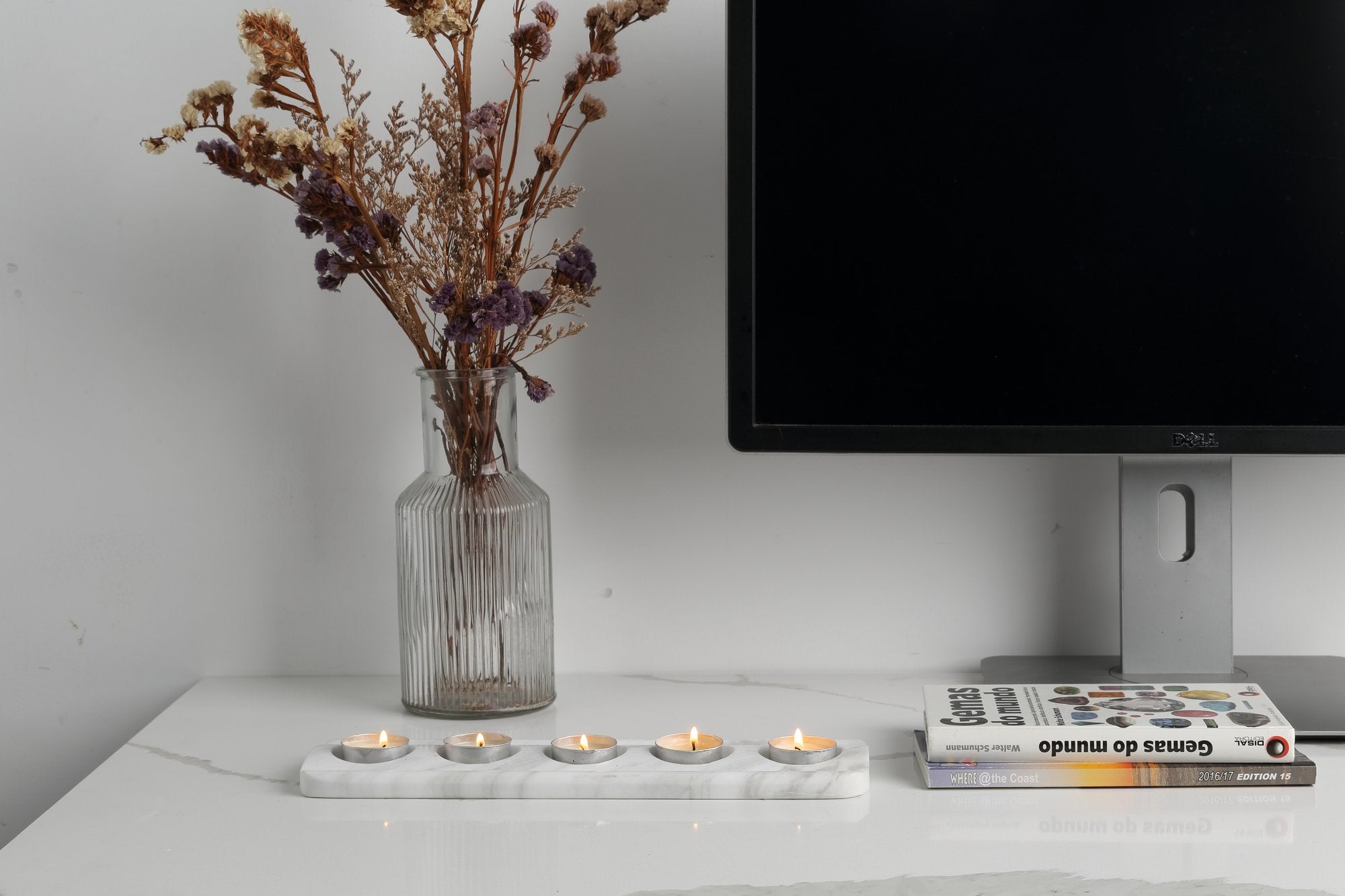 Koville natural marble tea light candle holder 5 holes in Agiax with a lit tea light candle
