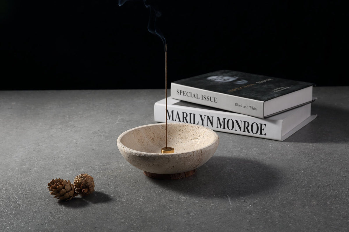 Koville Travertine incense holder placed on stacked books