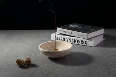 Koville Travertine incense holder placed on stacked books