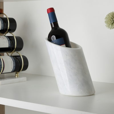 Koville Natural Stone Angled Wine Cooler in Namib Fantasy on a bar counter with a wine bottle