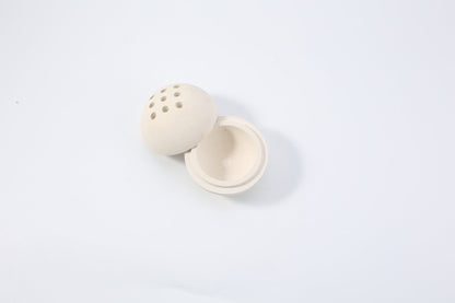 Koville natural marble incense burner d 100 in Moleanos Beige with burning incense stick