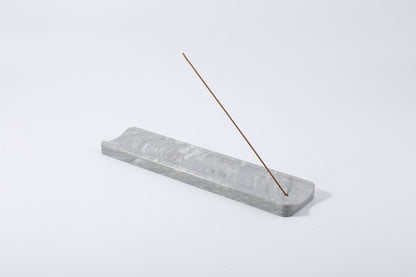 Koville natural marble incense holder slanted hole in Palissandro Blue with burning incense stick