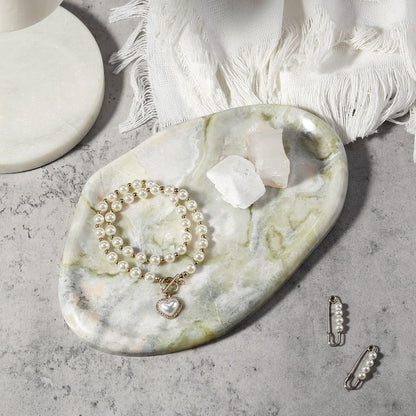 Koville lace edge storage tray for small items in Bianco Palomino natural stone