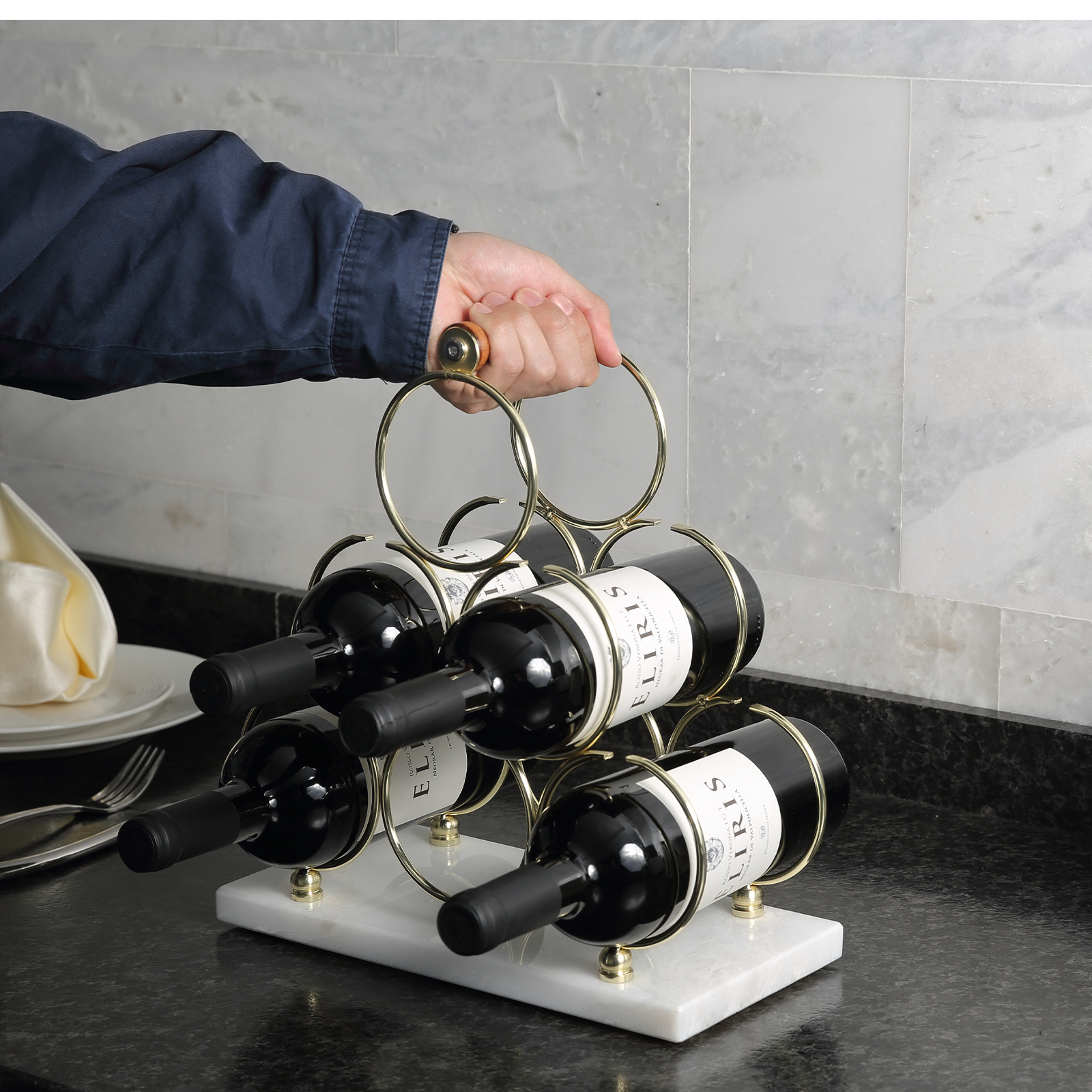 Koville Natural Stone Wine Rack in Karibib Ice on a kitchen counter holding wine bottles