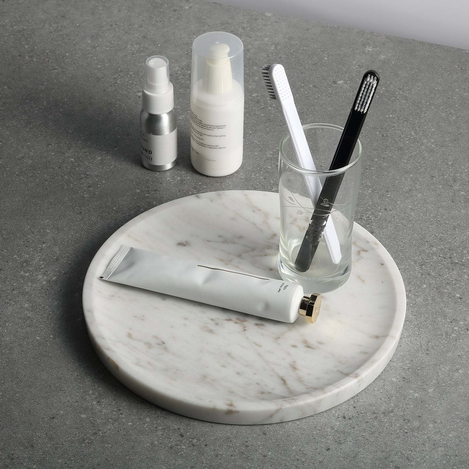 Koville round serving tray in multiple sizes for table styling in Volakas natural stone