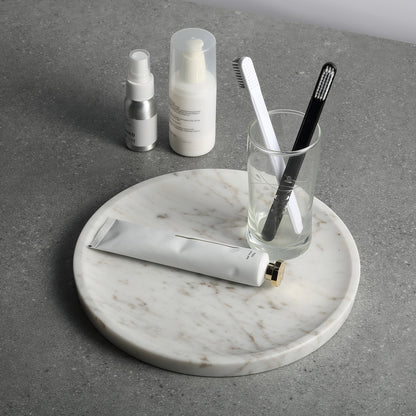 Koville round serving tray in multiple sizes for table styling in Volakas natural stone
