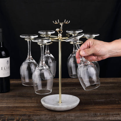 Koville Natural Stone Stemware Rack in Namib Fantasy mounted under a cabinet holding wine glasses