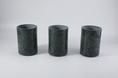 Koville Natural Stone Straight Wine Cooler in Indian Green on a dining table with a wine bottle