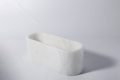 Koville natural marble candlelight cup 200 76 76 in Namib Bianco with a lit tea light candle