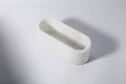 Koville natural marble candlelight cup 200 76 76 in Namib Bianco with a lit tea light candle