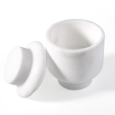 Koville candle holder in Namib Bianco with a lit tea light candle