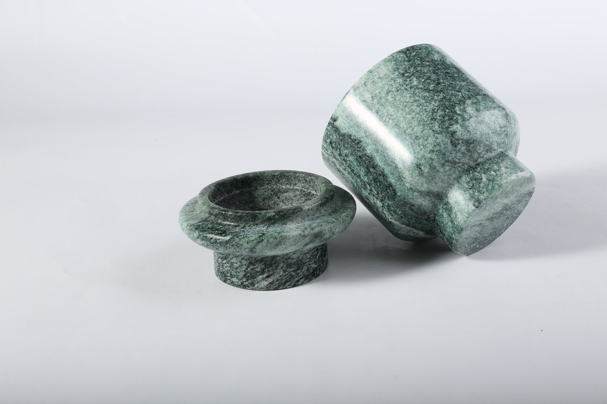 Koville natural marble candlelight cup d 100 t 140 in Verde Lapponia with a lit tea light candle