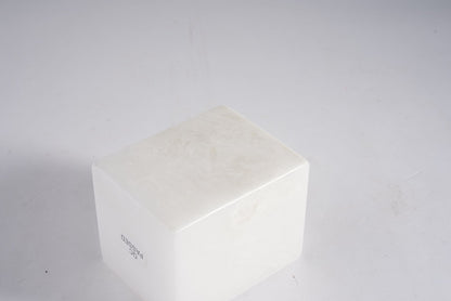 Koville natural marble candlelight cup d 70 in Namib Bianco with a lit tea light candle