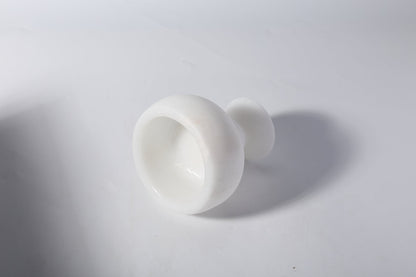 Koville natural marble candlelight cup d 99 in Namib Bianco with a lit tea light candle