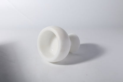 Koville natural marble candlelight cup d 99 in Namib Bianco with a lit tea light candle