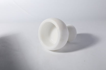 Koville natural marble candlelight cup d 99 in Namib Bianco with a lit tea light candle