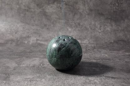 Koville natural marble incense burner d 100 in Indian Green with burning incense stick