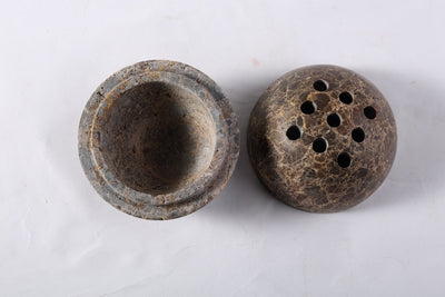 Koville incense burner in Light Emperador with burning incense stick