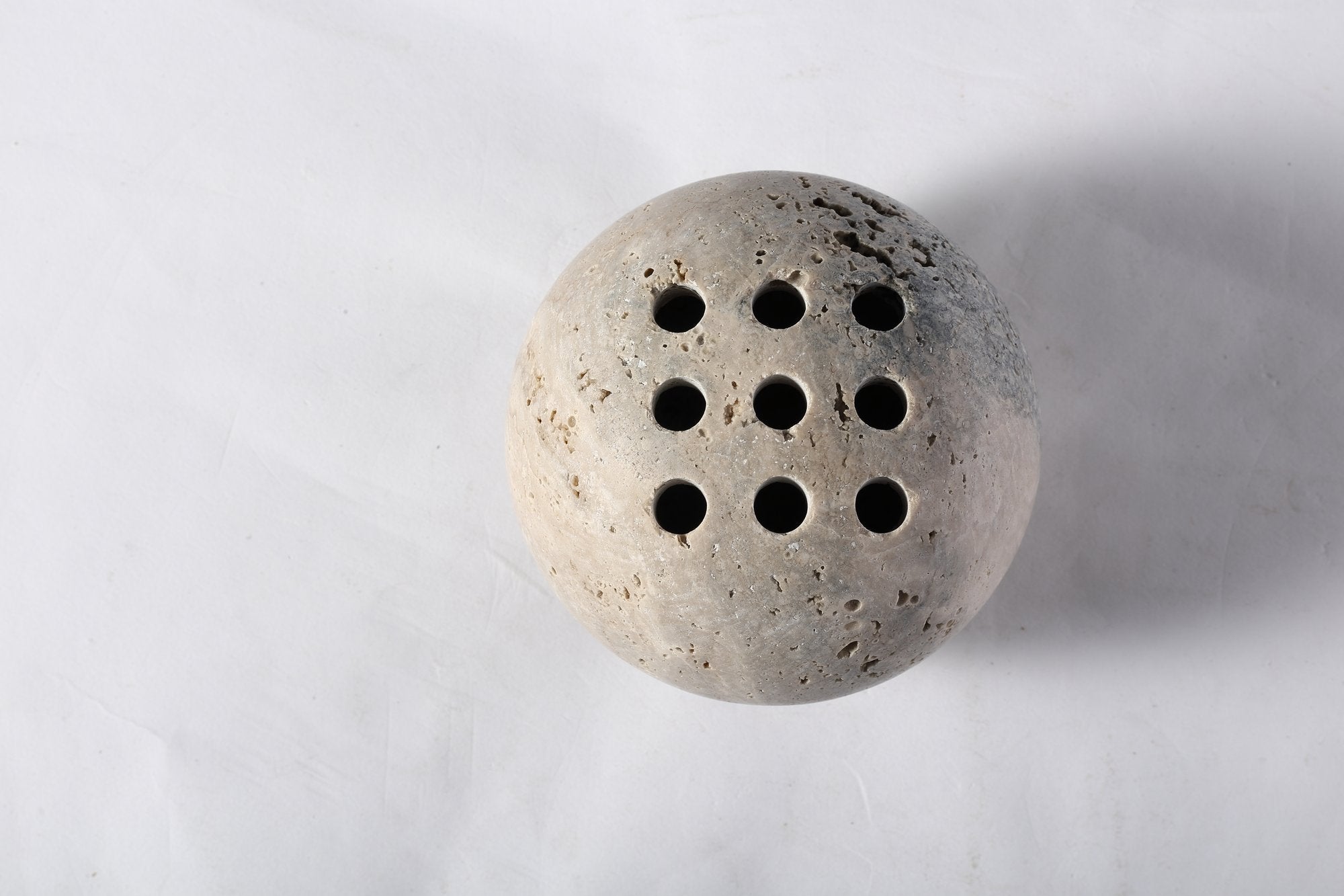 Koville natural marble incense burner d 100 in Travertine Silver with burning incense stick