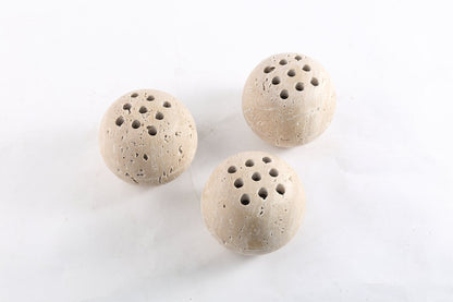 Koville natural marble incense burner d 100 in Travertino Romano with burning incense stick