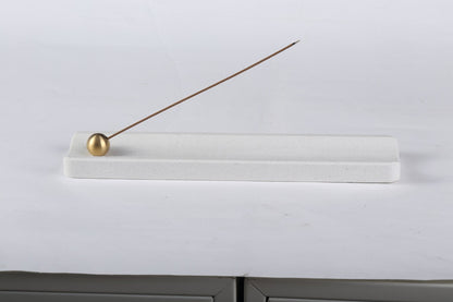 Koville natural marble incense holder in Ariete Quarella with burning incense stick