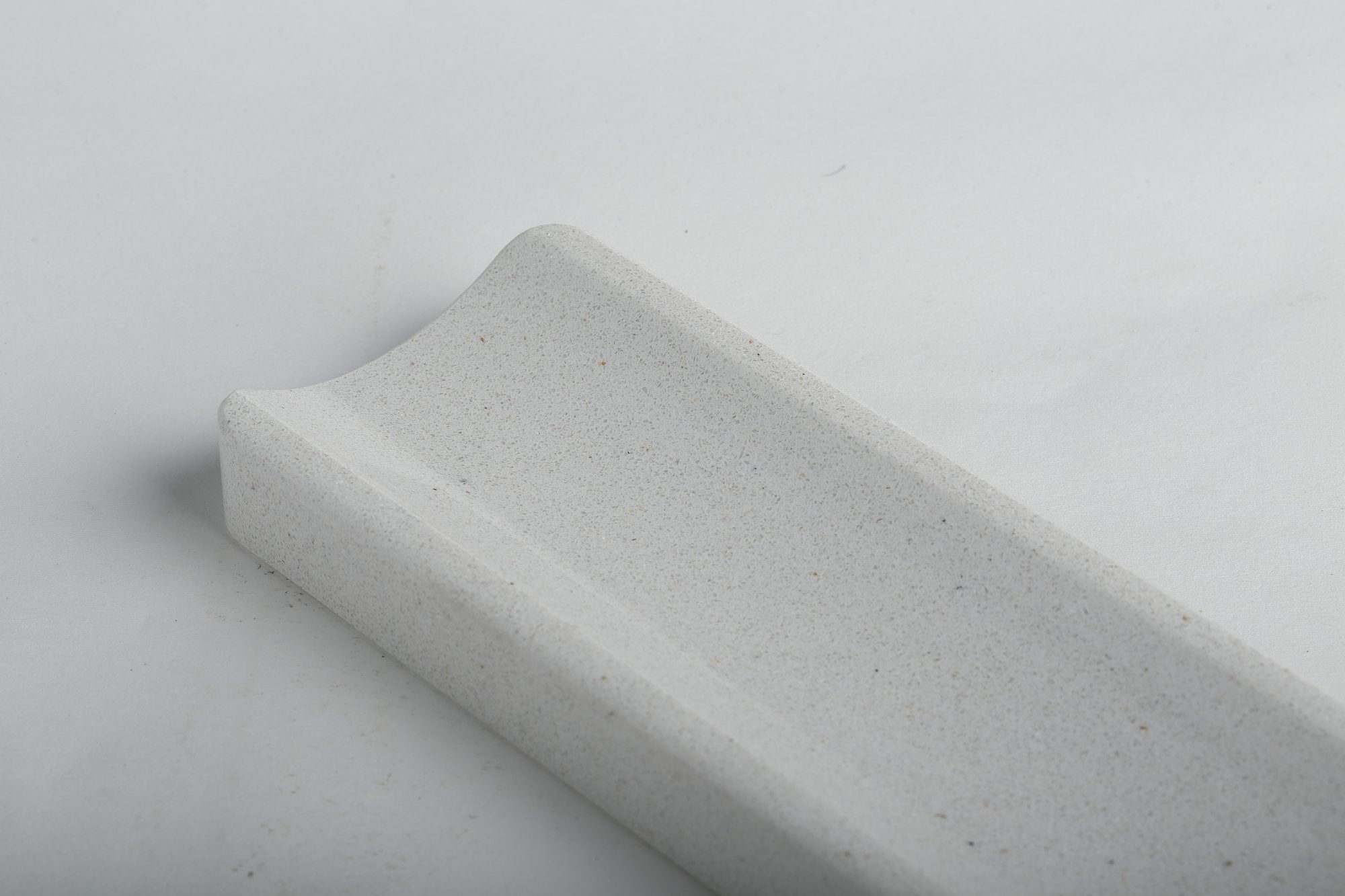 Koville natural marble incense holder in Ariete Quarella with burning incense stick
