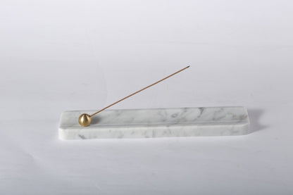 Koville natural marble incense holder in Bianco Carrara with burning incense stick