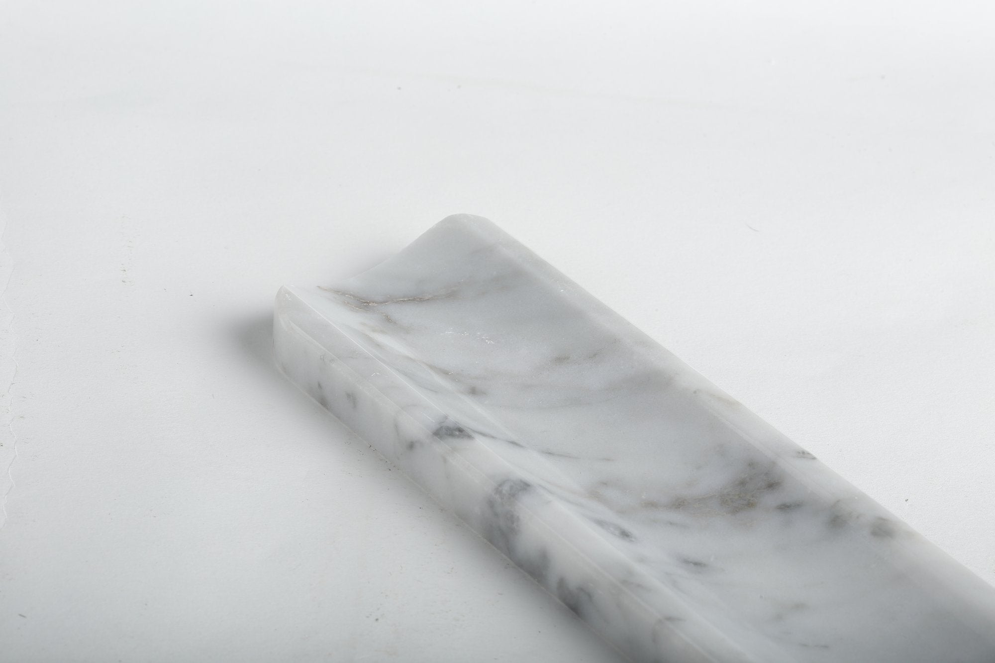 Koville natural marble incense holder in Bianco Carrara with burning incense stick