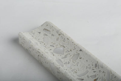 Koville incense holder in Calacatta Quarella with burning incense stick
