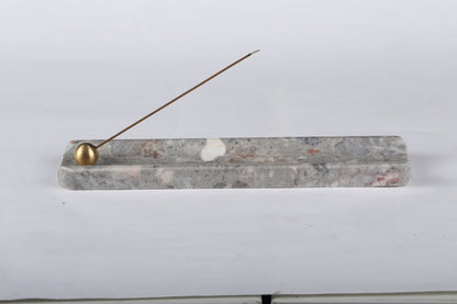 Koville natural marble incense holder in Fior di Pesco Quarella with burning incense stick
