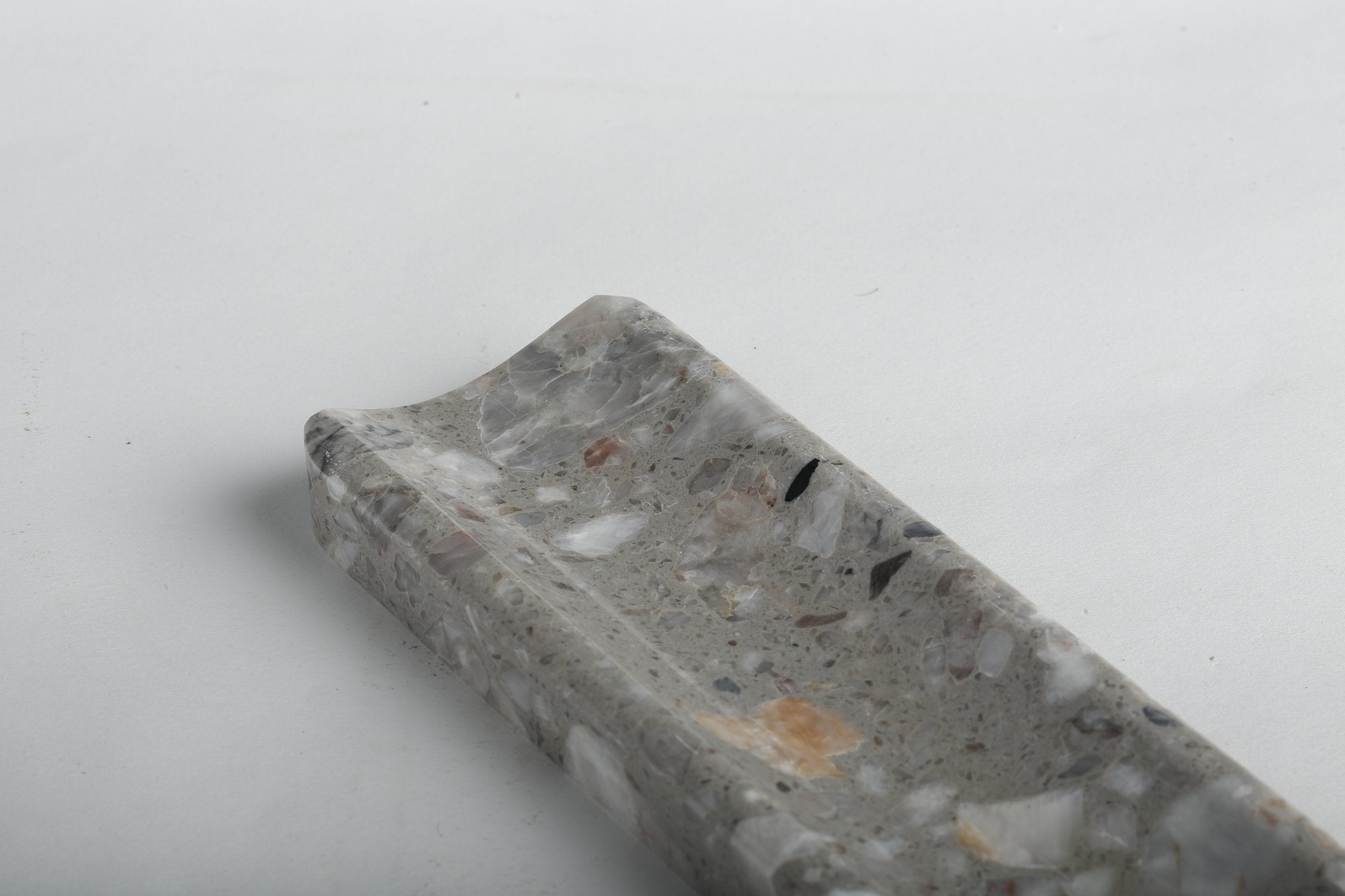 Koville natural marble incense holder in Fior di Pesco Quarella with burning incense stick