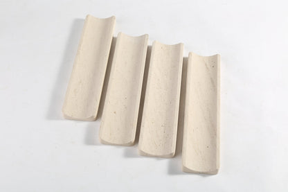 Koville natural marble incense holder in Moca Crema with burning incense stick