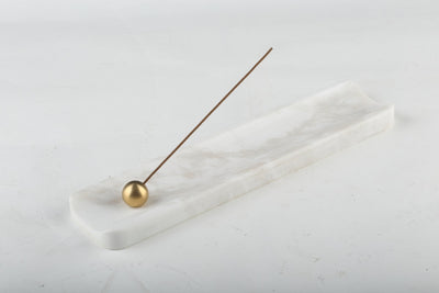 Koville incense holder in Namib Bianco with burning incense stick