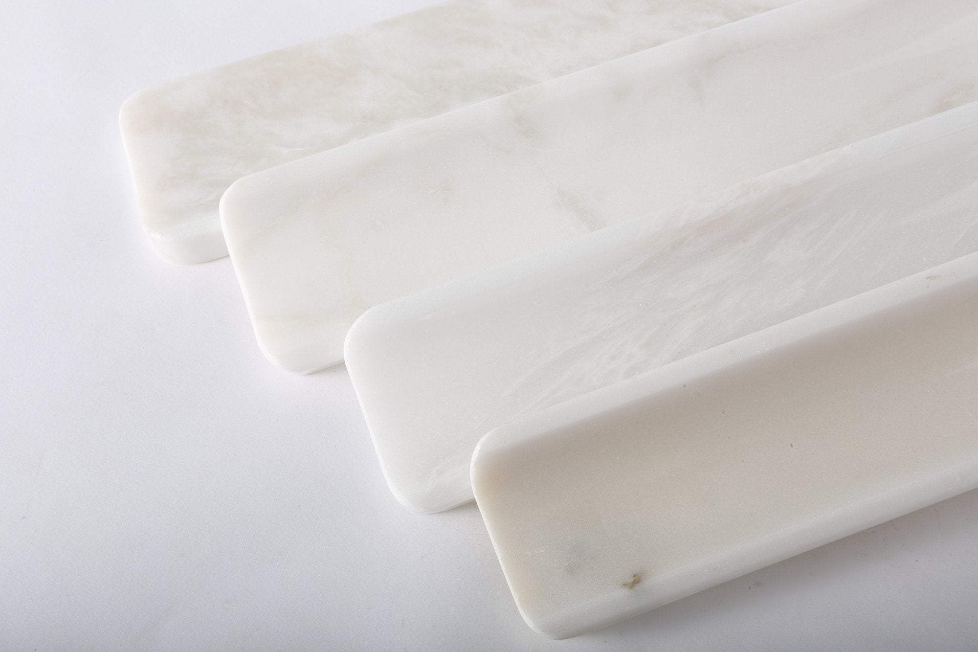 Koville natural marble incense holder in Namib Bianco with burning incense stick