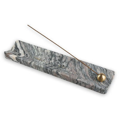 Koville incense holder in Rosso Luana with burning incense stick