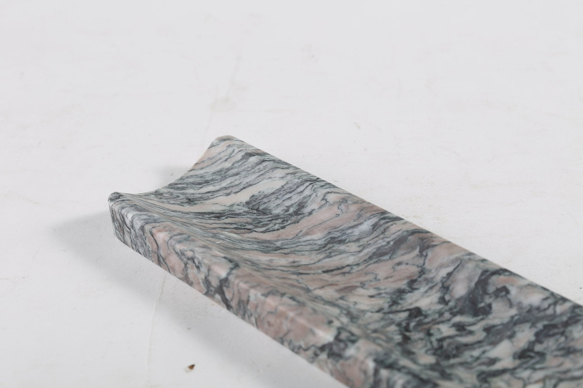 Koville natural marble incense holder in Rosso Luana with burning incense stick